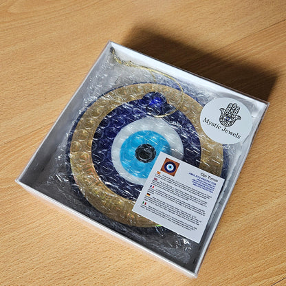 MYSTIC JEWELS Amuleto Ojo Turco de Pared 13 cm – Vidrio con marco dorado y diseño griego – Decoración colgante con cuerda – Caja de regalo incluida